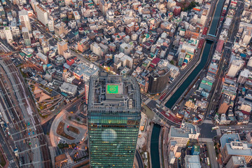 Top view of the tokyu city, the modern look of beautiful and busy town with buildings, road, railway and canel.