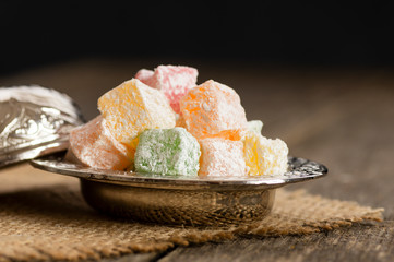 Turkish delight in hollowware , traditional fruity flavored turkish sweet food