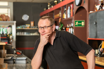 pub host worries because he has no guests because of corona restriction