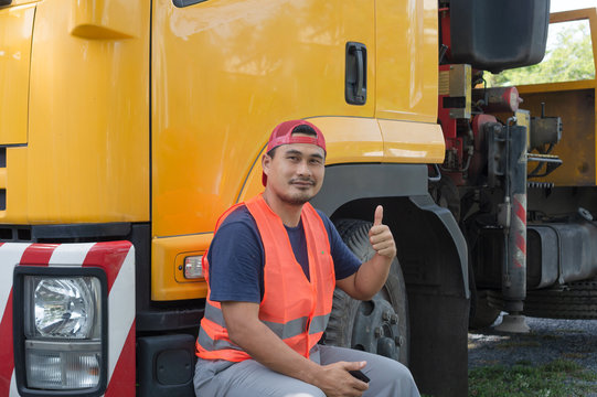 The Smile Of A Professional Truck Driver In A Long Transportation