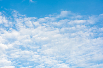 Cirrus clouds on blue sky background..