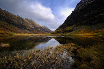 Loch Achtriochtan, Glencoe in the dramatic highlands of scenic Scotland, fantastic adventure travel destination or holiday vacation to view picturesque scenery at sunrise or sunset