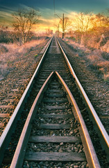 Railway line straight to the beautiful sunset