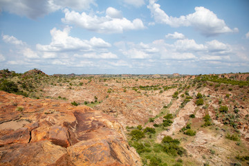 Obraz premium View over a dry rocky plain from a visitor platform in Mapungubwe National Park, South Africa