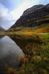 Loch Achtriochtan, Glencoe in the dramatic highlands of scenic Scotland, fantastic adventure travel destination or holiday vacation to view picturesque scenery at sunrise or sunset