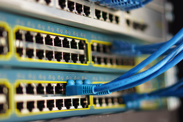 Closed data center Internet provider. Cable and switch connections. High speed internet network. Computer network, Ethernet telecommunication cables connected to the Internet. LAN