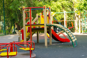 Playground in the courtyard of a multi-storey residential building.