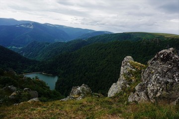 Top view on lake Schiessrothried with hilly landscape of the Vosges