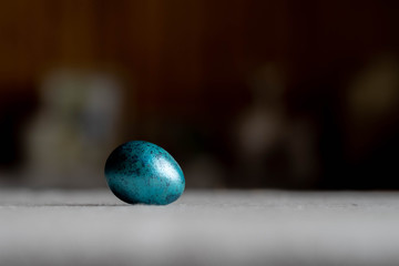 blue painted quail egg. Preparing for Easter. Colorful eggs. Beautiful multi-colored jewelry