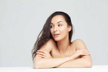 Portrait of young beautiful woman with clean perfect skin