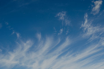 Naklejka na ściany i meble Soft clouds on blue sky