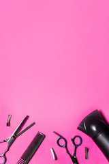 hairdressing accessories on a pink background look from above, mock up, nobody