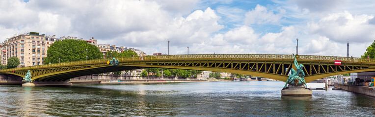 Paris, France: Panoramic view of Pont Mirabeau bridge with eiffel tower in background.