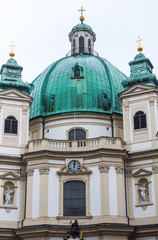 Fototapeta na wymiar Facade of Peterkirche (St. Peter's church) in the old town, a Baroque Roman Catholic parish church in Vienna, Austria