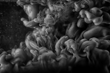 Black and white photo of an ink explosion. The idea of spreading an unknown dangerous liquid