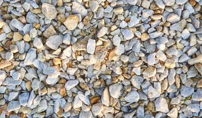 Background of light stone, chippings stone closeup. Stone texture. 