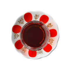 Turkish Tea in traditional glass with traditional tea plate. Top view. Turkish Tea glass with thin...