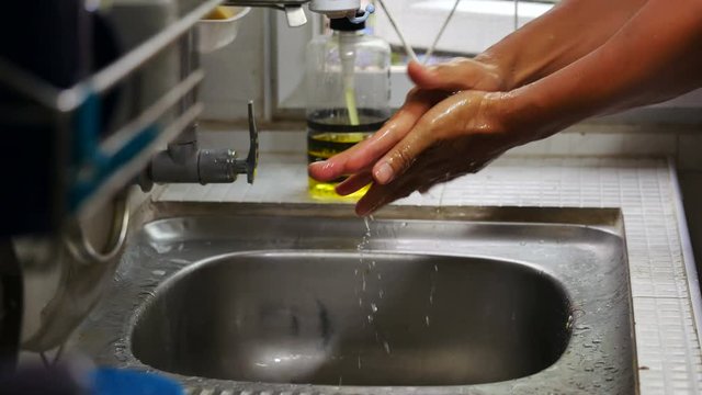 Hand washing with soap, Coronavirus (Covid-19) pandemic prevention outbreak. Rubbing nails, fingers,backhanded and wrist. Hygiene to stop spreading germs and bacteria. Health - cleanliness concept.