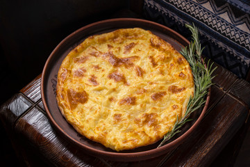 Hospitable Georgian cuisine. Khachapuri with cheese on a wooden background