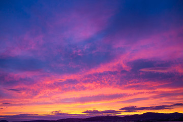 Fototapeta na wymiar Sunset sky full of clouds with warm tones