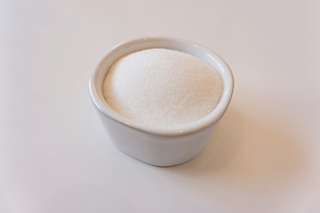 white sugar isolated in a sugar bowl