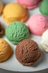 assorted scoopes of ice cream on plate