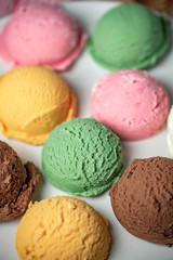 assorted scoopes of ice cream on plate
