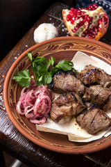 Grilled meat on pita with pickled onions and herbs
