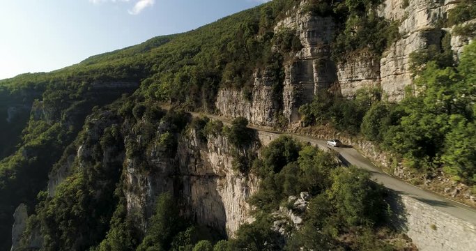 Car drives along narrow road in Gorges du Verdon, France in autumn