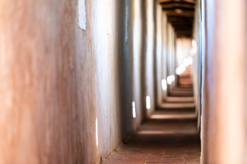 Fortress tunnel path passage abstract pattern in Castiglione del Lago in Italy during summer with windows and shadows in historic town village fort