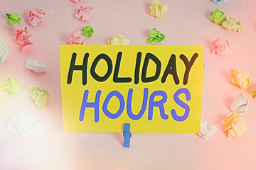 Text sign showing Holiday Hours. Business photo text employee receives twice their normal pay for...