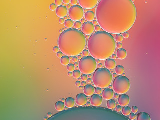 Tranquil pastel rainbow oil on water bubble abstract background.