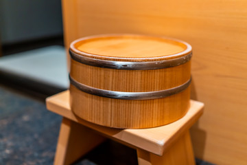 Cypress sauna bathtub wooden bucket traditional Japanese room with water stool in home house or onsen hotel bathroom interior with nobody in Japan