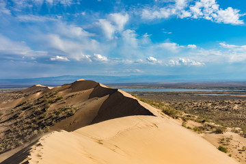 Sand dune blue skies in sunny day