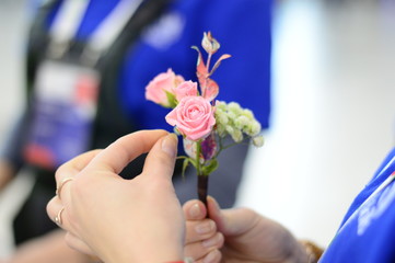 Hand Arranging Flower At school