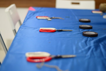 a few scissors lying on the blue florist's table