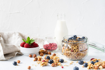 Healthy breakfast set on grey background. The concept of delicious and healthy food. Top view, copy space.