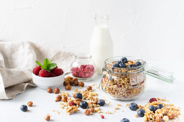 Healthy breakfast set on grey background. The concept of delicious and healthy food. Top view, copy space.