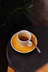 cup of fresh espresso in a coffee shop