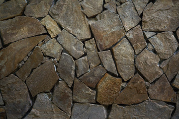 Wall with imitation of natural stone, texture background.