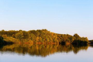 Beautiful river landscape. The Bolshoi Irgiz River, Saratov Region. Sunset on the river.