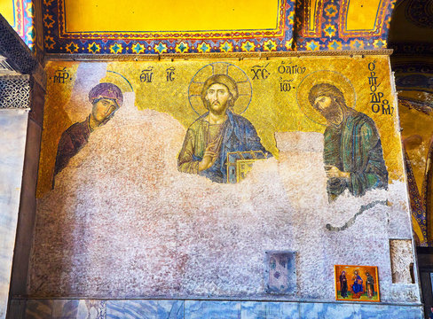 Istanbul, Turkey - July 10, 2018. The Deesis Mosaic, a Byzantine mosaic located in the upper south gallery of the Hagia Sophia mosque, representing Christ, Virgin Mary and St. John the Baptist.