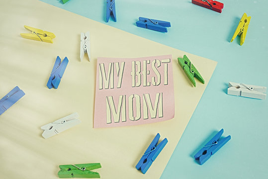 Writing note showing My Best Mom. Business concept for Appreciation for your mother s is love feelings compliment Colored clothespin paper reminder with yellow blue background
