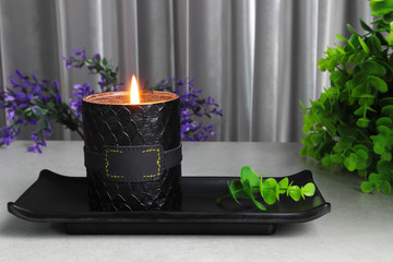 The luxury lighting aromatic scent glass candles are displayed in the grey bed room