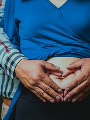 pregnant woman holding her belly