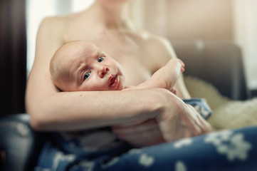 Tired baby lies on the hand