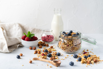 Healthy breakfast set on grey background. The concept of delicious and healthy food. Top view, copy space.