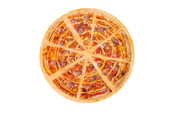 Sliced pizza with beef sausages, mozzarella, various sauces and marinated red onions on a round wooden platter, isolated on white background, top view