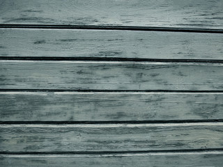 Light wood plank texture background. A wooden board with a textured surface, scratches and patterns. Wooden fence, wood texture, wooden background.