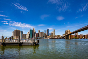 Fototapeta na wymiar Famous Skyline of downtown New York and Brooklin Bridge